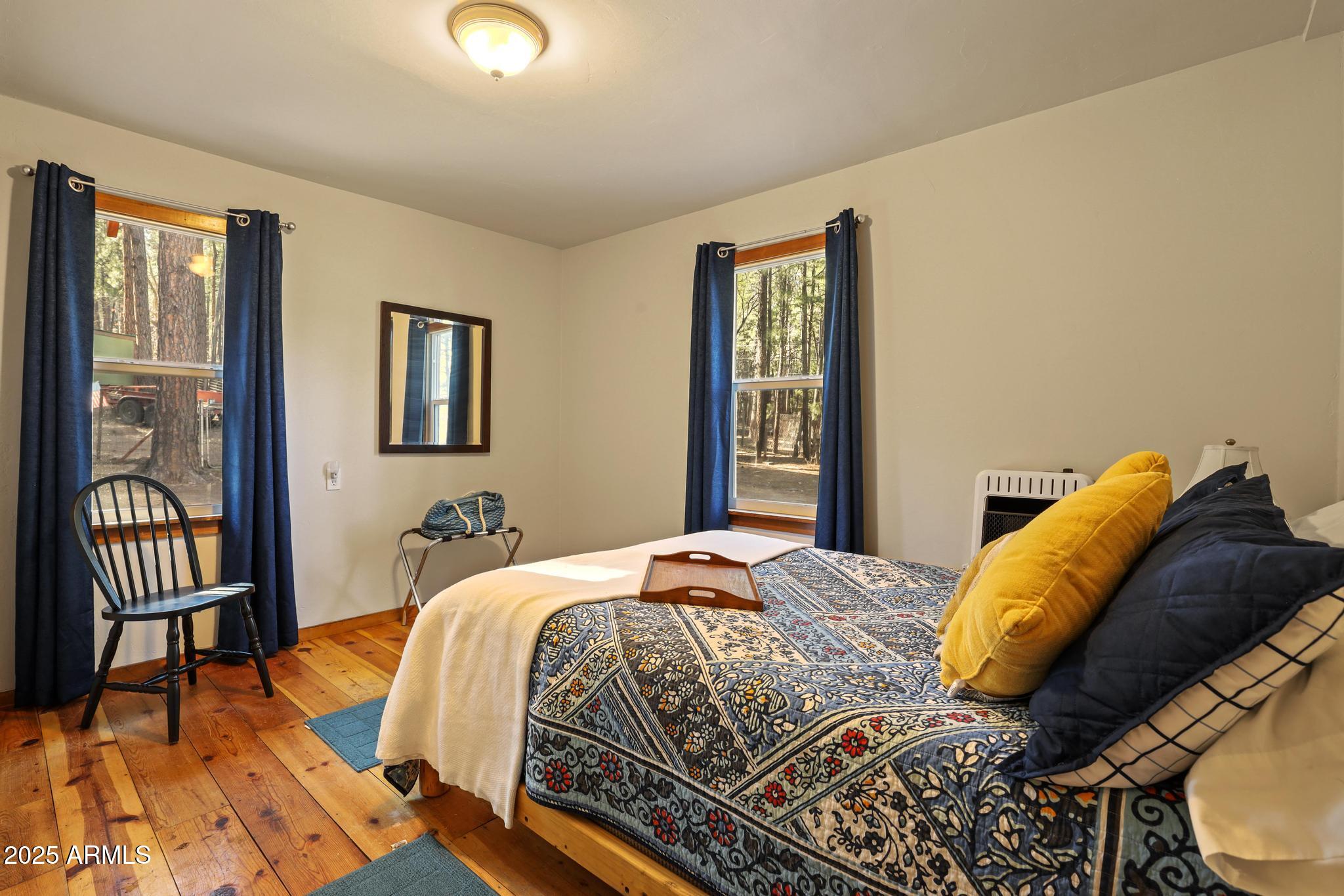 199 West Mockingbird Lane Payson, AZ 85541 - Photo 15 of 36 a bed sitting in a bedroom next to a window