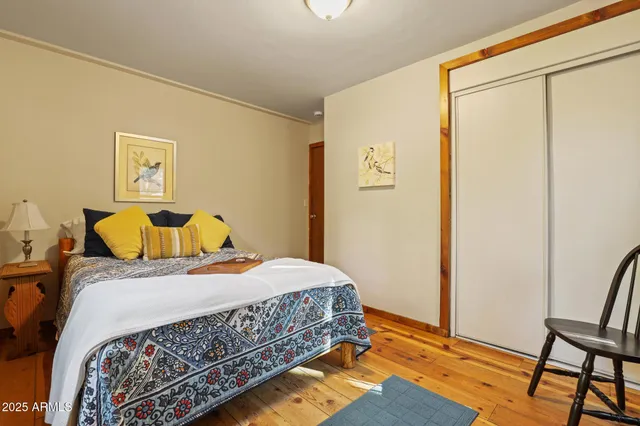 a bedroom with a bed and a table in it