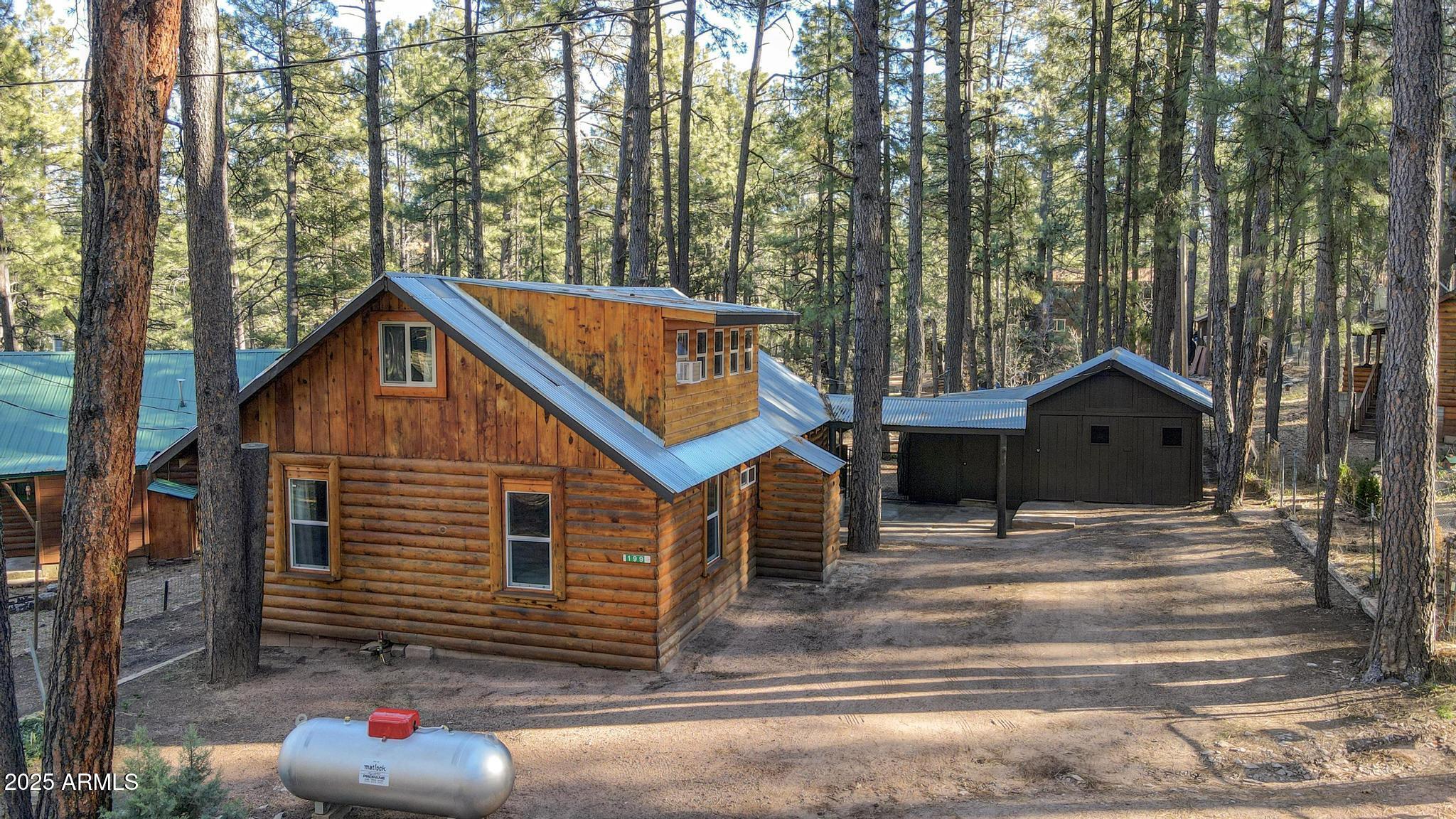 199 West Mockingbird Lane Payson, AZ 85541 - Photo 2 of 36 a view of house and tree in the background