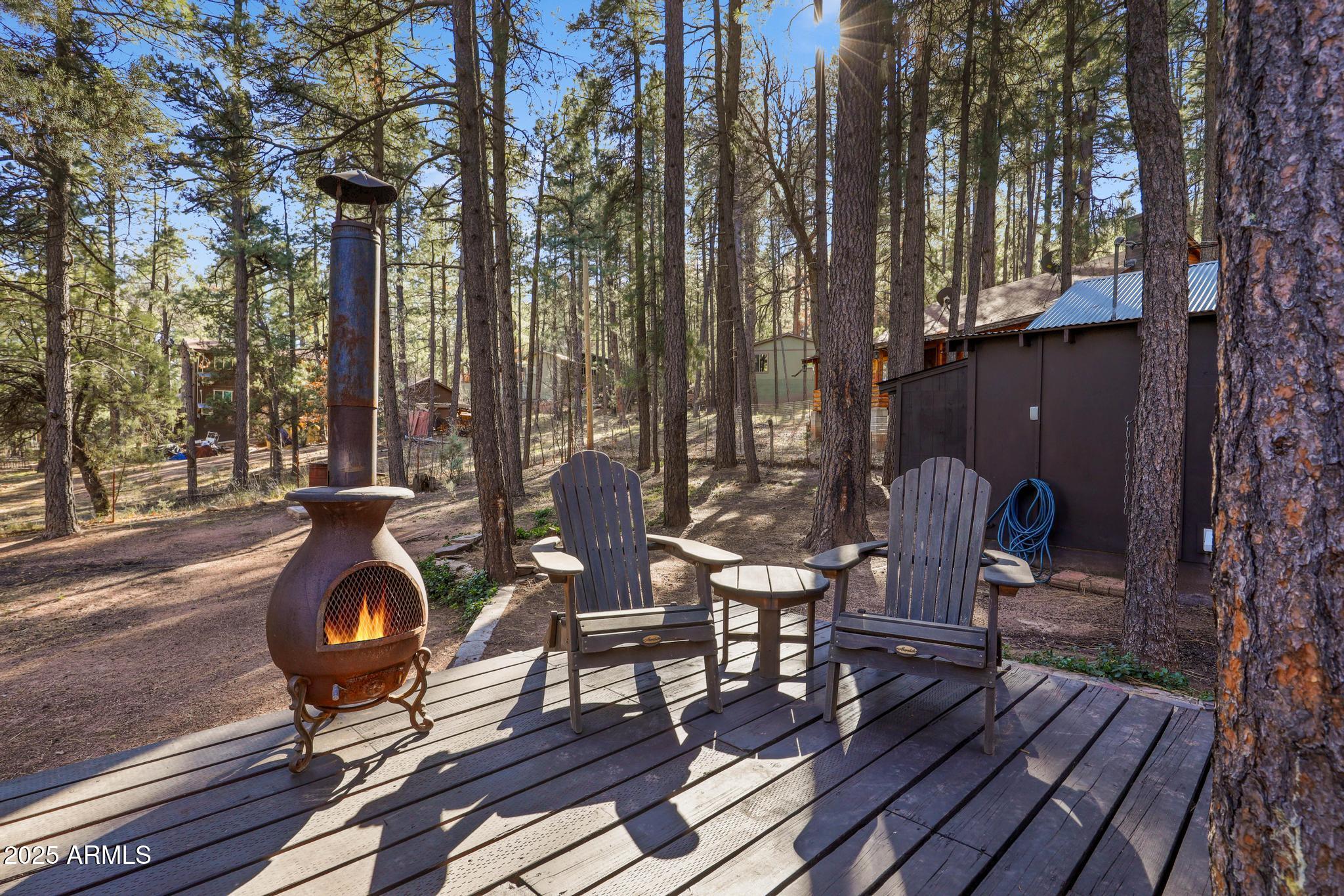 199 West Mockingbird Lane Payson, AZ 85541 - Photo 25 of 36 a backyard of a house with barbeque oven and outdoor seating