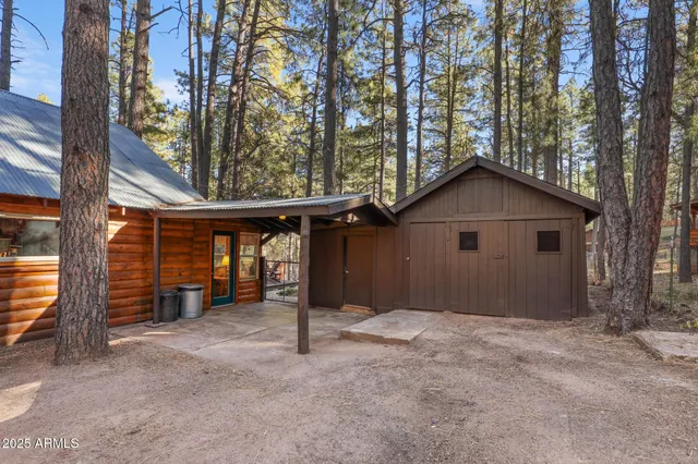 a view of a house with a yard and garage