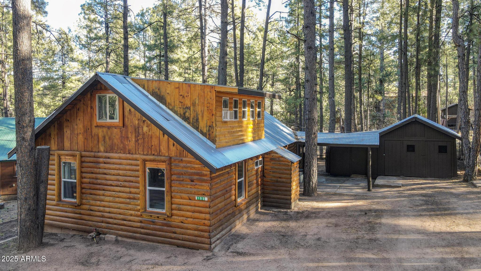199 West Mockingbird Lane Payson, AZ 85541 - Photo 33 of 36 a view of a house with a yard