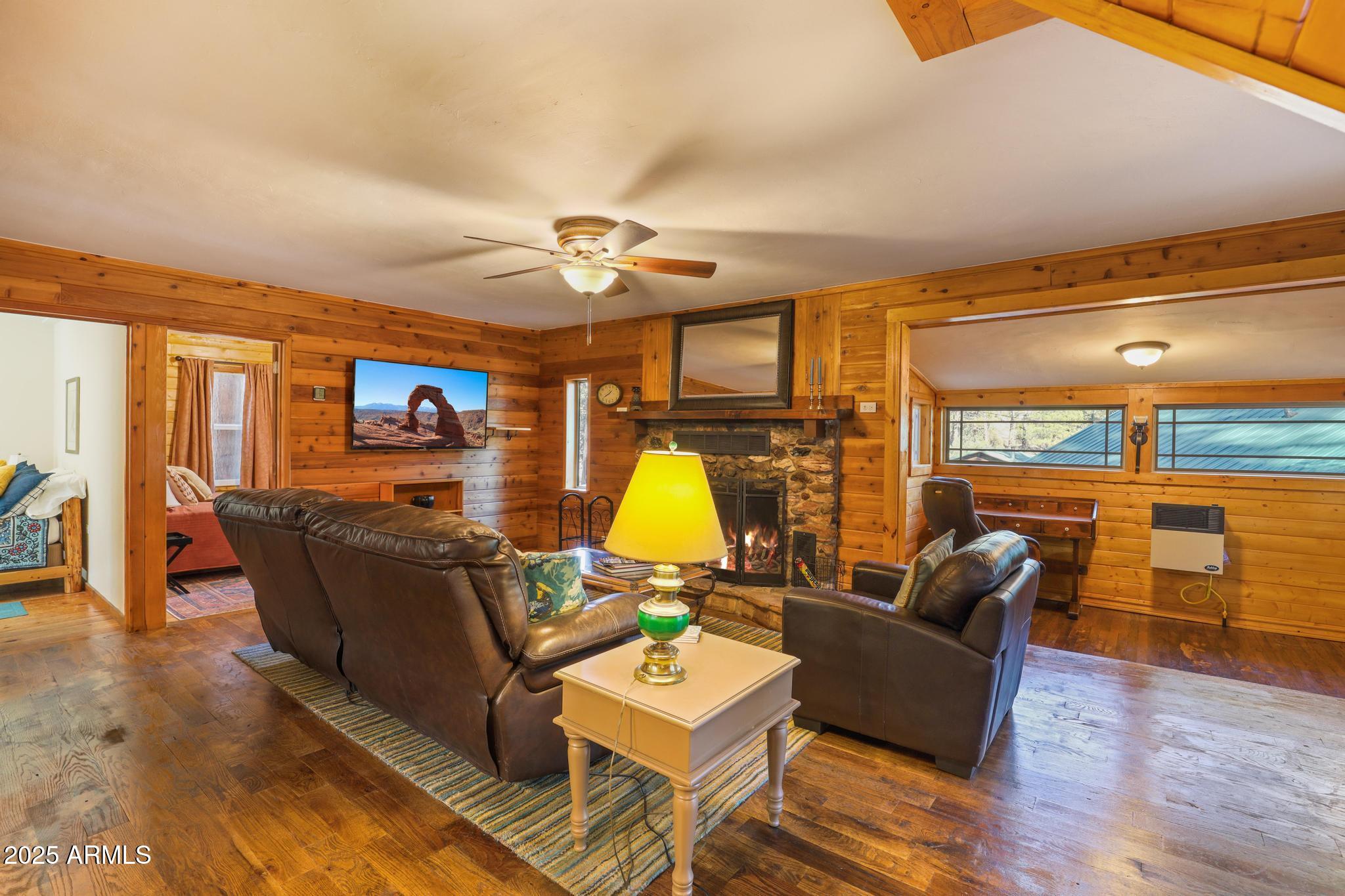 199 West Mockingbird Lane Payson, AZ 85541 - Photo 9 of 36 a living room with furniture and a chandelier