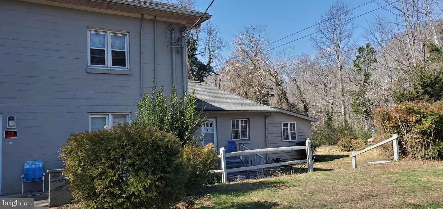 45 Warrenton Road, Unit 6 Fredericksburg, VA 22405 - Photo 1 of 9 a view of a house with a yard and wooden fence