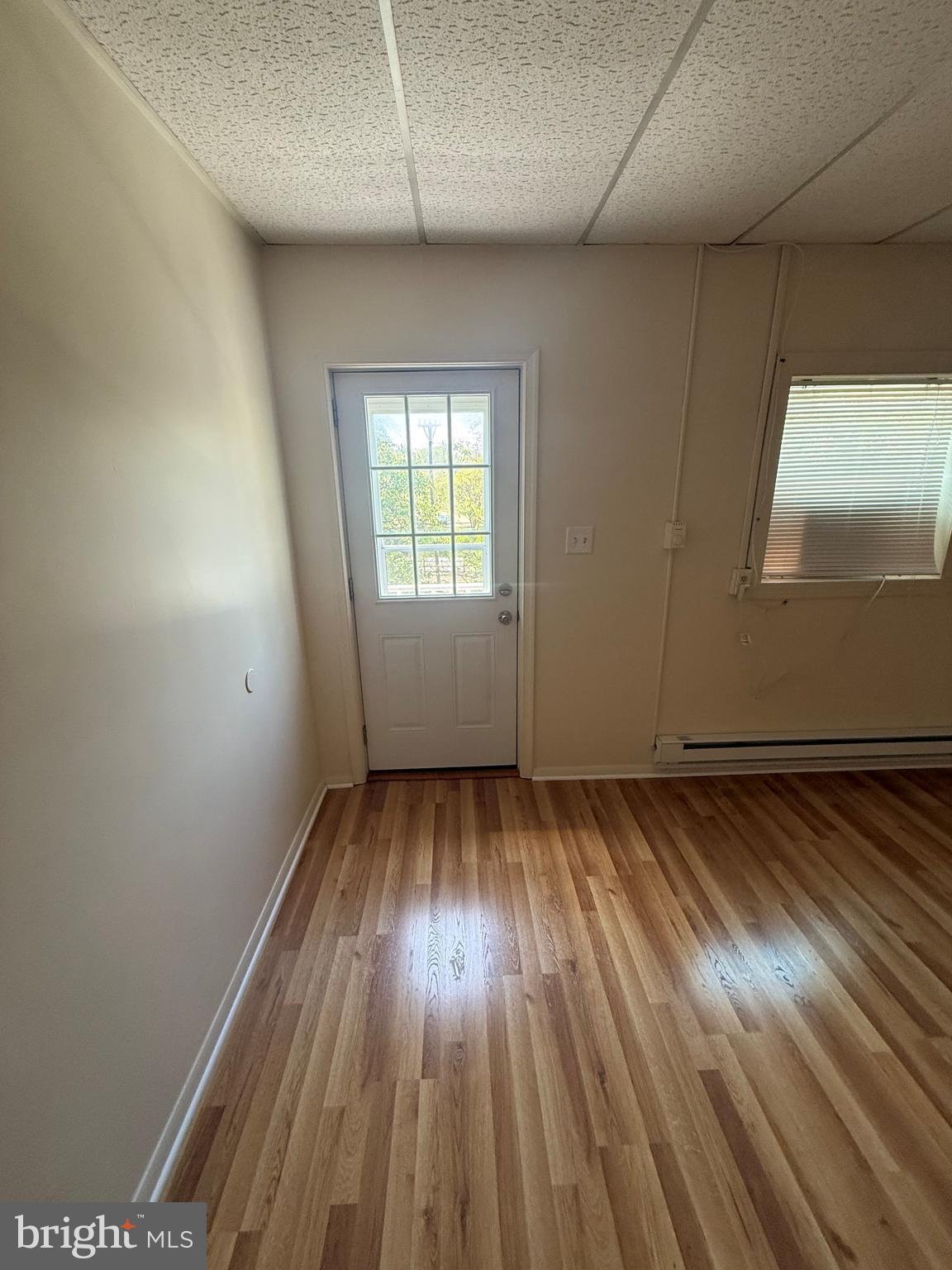45 Warrenton Road, Unit 6 Fredericksburg, VA 22405 - Photo 3 of 9 an empty room with wooden floor and windows