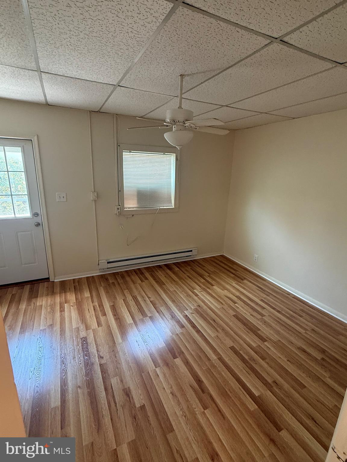 45 Warrenton Road, Unit 6 Fredericksburg, VA 22405 - Photo 6 of 9 wooden floor in an empty room with a window