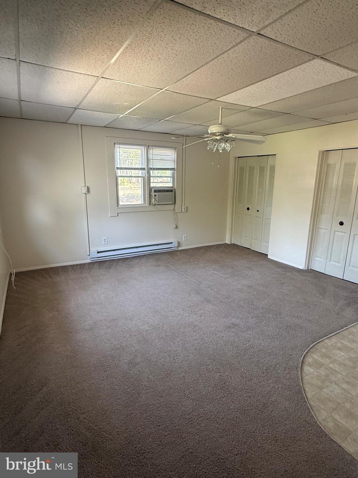 45 Warrenton Road, Unit 6 Fredericksburg, VA 22405 - Photo 9 of 9 en empty room with windows and closet