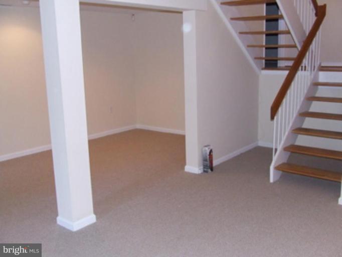 11186 Saffold Way Reston, VA 20190 - Photo 11 of 15 a view of empty room with stairs