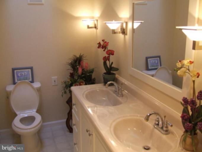 11186 Saffold Way Reston, VA 20190 - Photo 3 of 15 a bathroom with a sink and a toilet