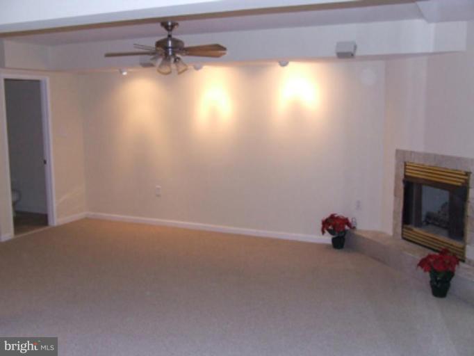 11186 Saffold Way Reston, VA 20190 - Photo 9 of 15 a view of empty room with windows and fireplace