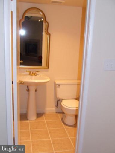 11186 Saffold Way Reston, VA 20190 - Photo 10 of 15 a bathroom with a toilet and a sink