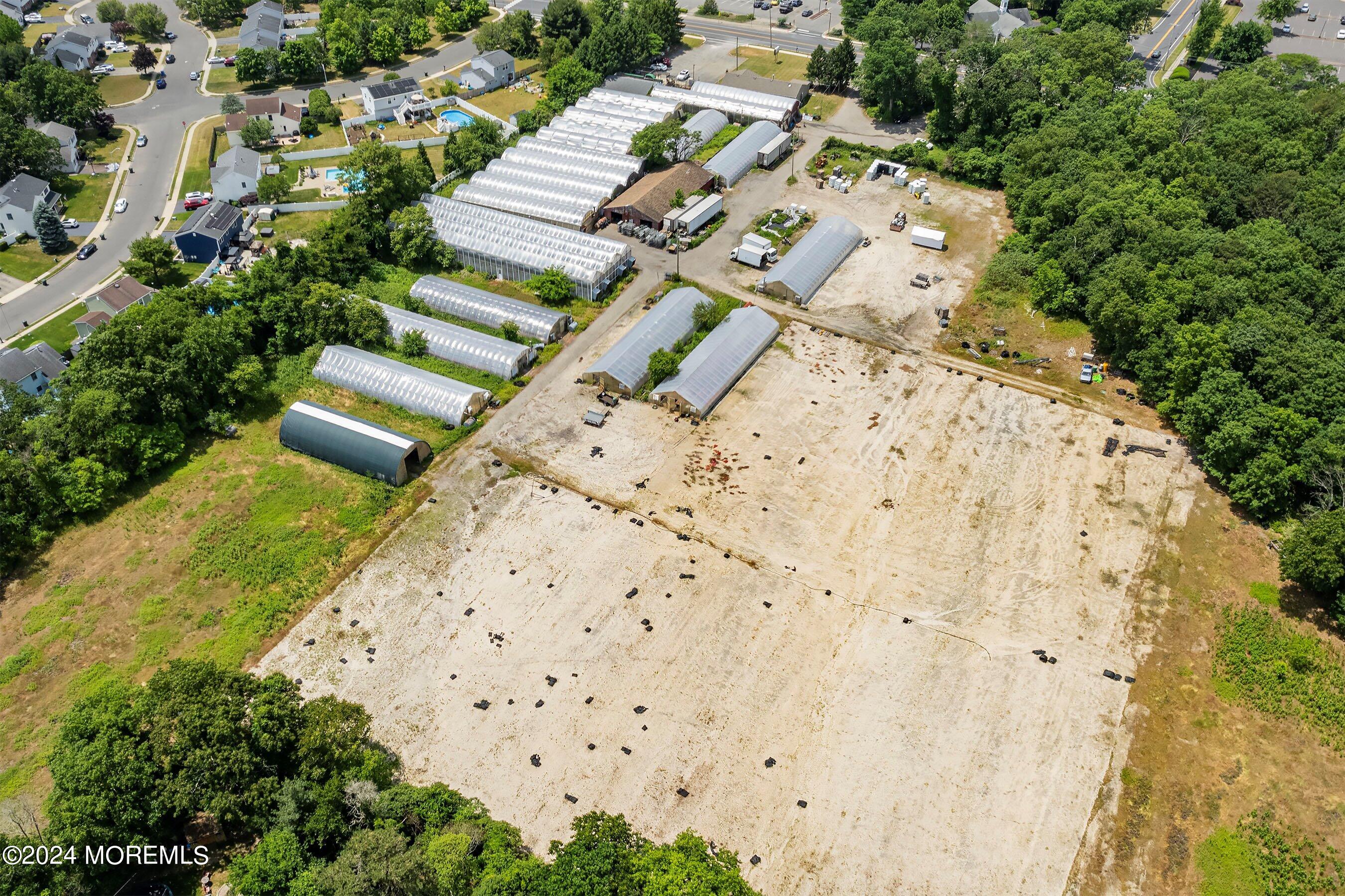 162 Newtons Corner Road Howell, NJ 07731 - Photo 11 of 12 an aerial view of a house with a garden