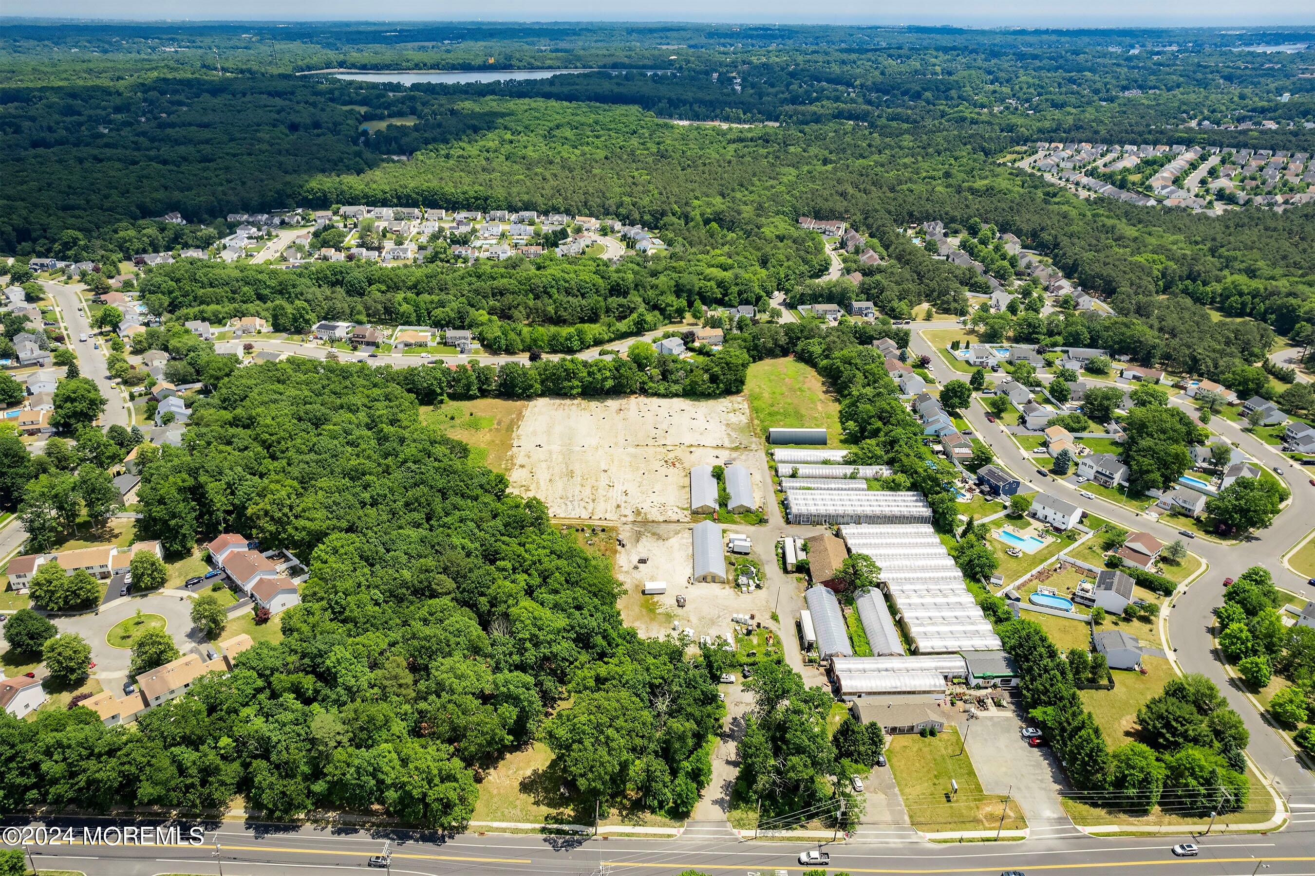 162 Newtons Corner Road Howell, NJ 07731 - Photo 3 of 12 an aerial view of residential houses with outdoor space
