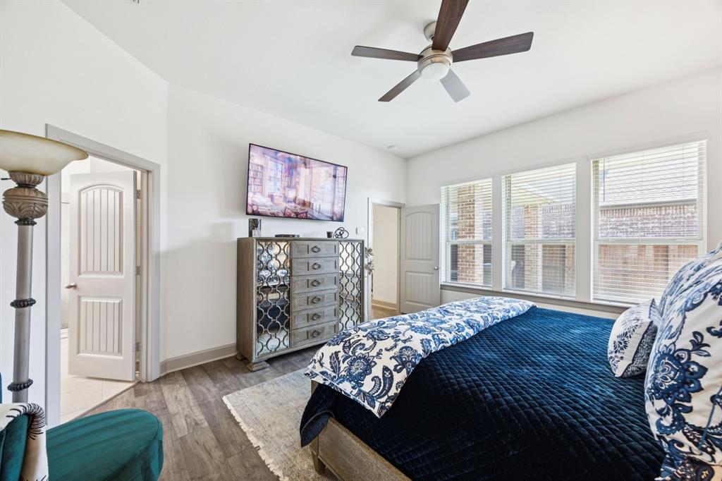 8905 Habersham Drive Rowlett, TX 75089 - Photo 13 of 31 Bedroom featuring wood finished floors and ceiling fan
