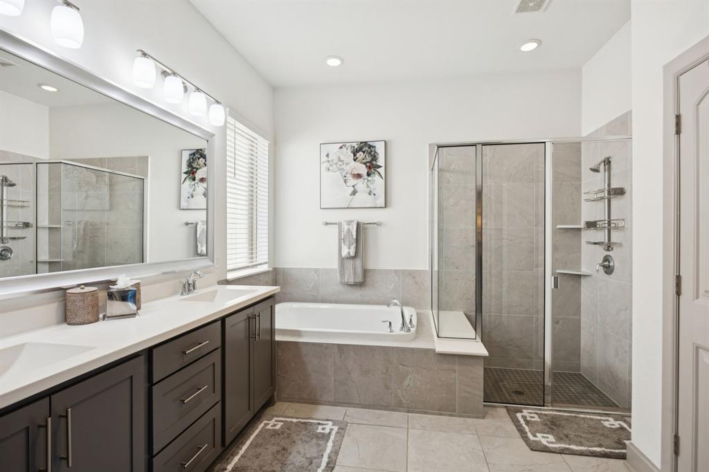 8905 Habersham Drive Rowlett, TX 75089 - Photo 16 of 31 Bathroom featuring double vanity, a bath, a stall shower, recessed lighting, and light tile patterned floors