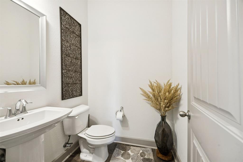 8905 Habersham Drive Rowlett, TX 75089 - Photo 18 of 31 Bathroom featuring toilet and baseboards