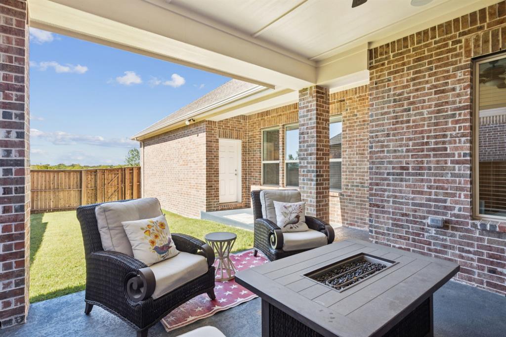 8905 Habersham Drive Rowlett, TX 75089 - Photo 24 of 31 View of patio / terrace with a fire pit, speakers, TV