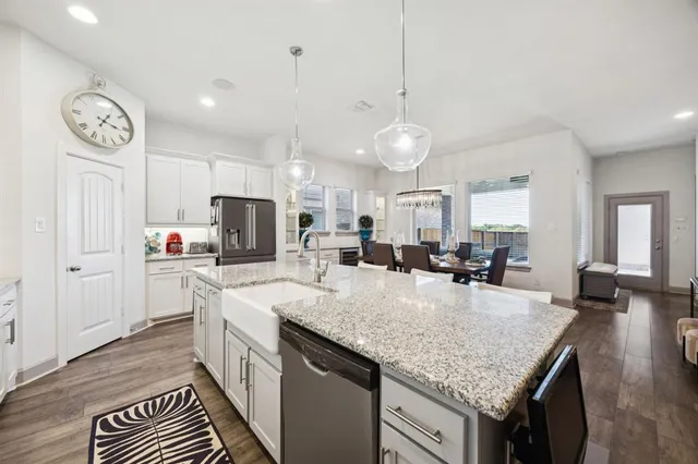 a kitchen with counter top space and appliances