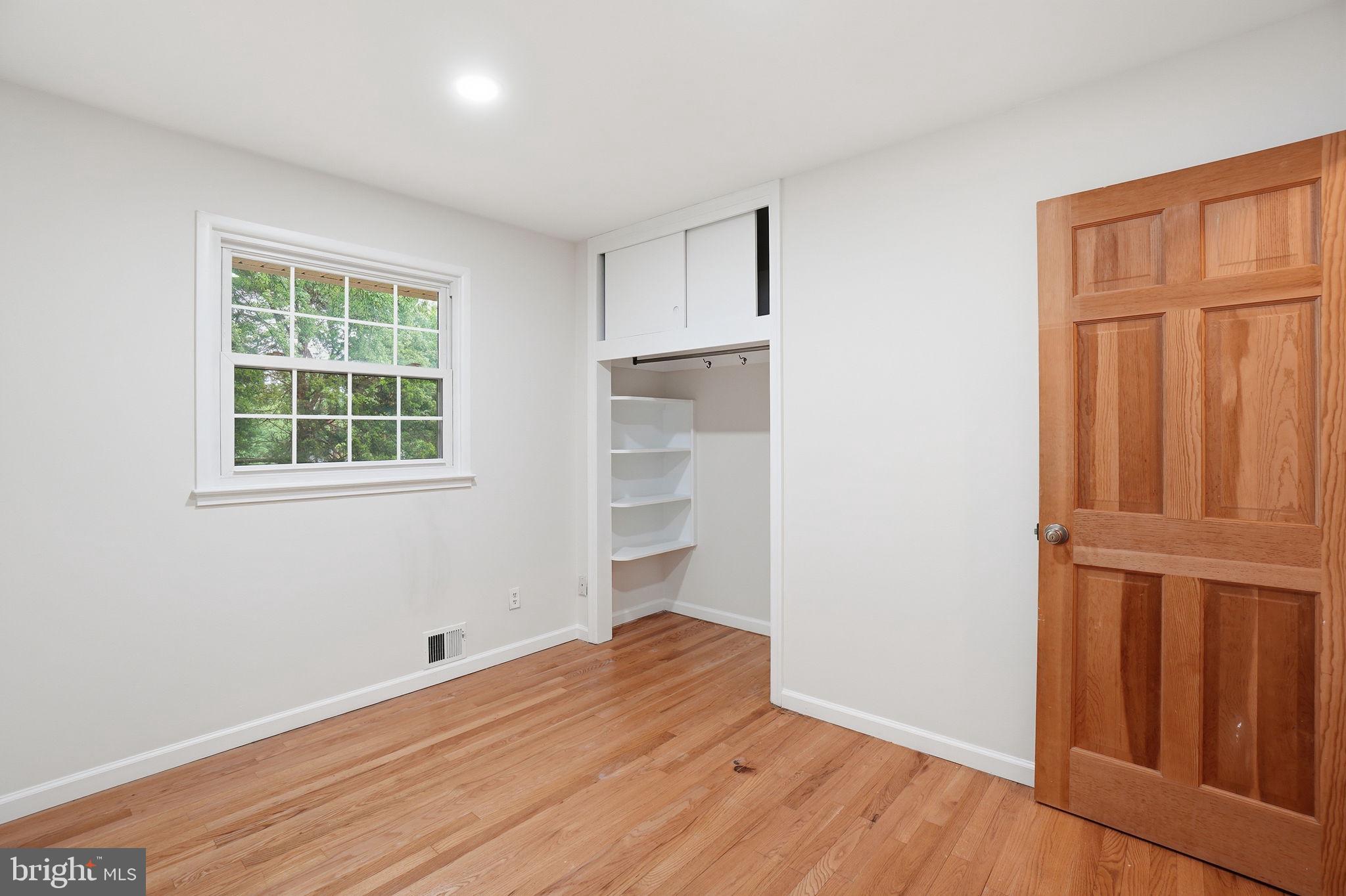 5304 Pillow Lane Springfield, VA 22151 - Photo 12 of 32 a view of empty room with wooden floor and fan