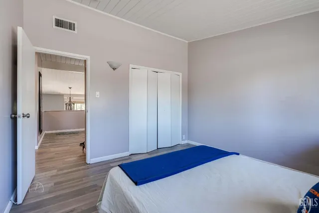 a view of hallway with wooden floor