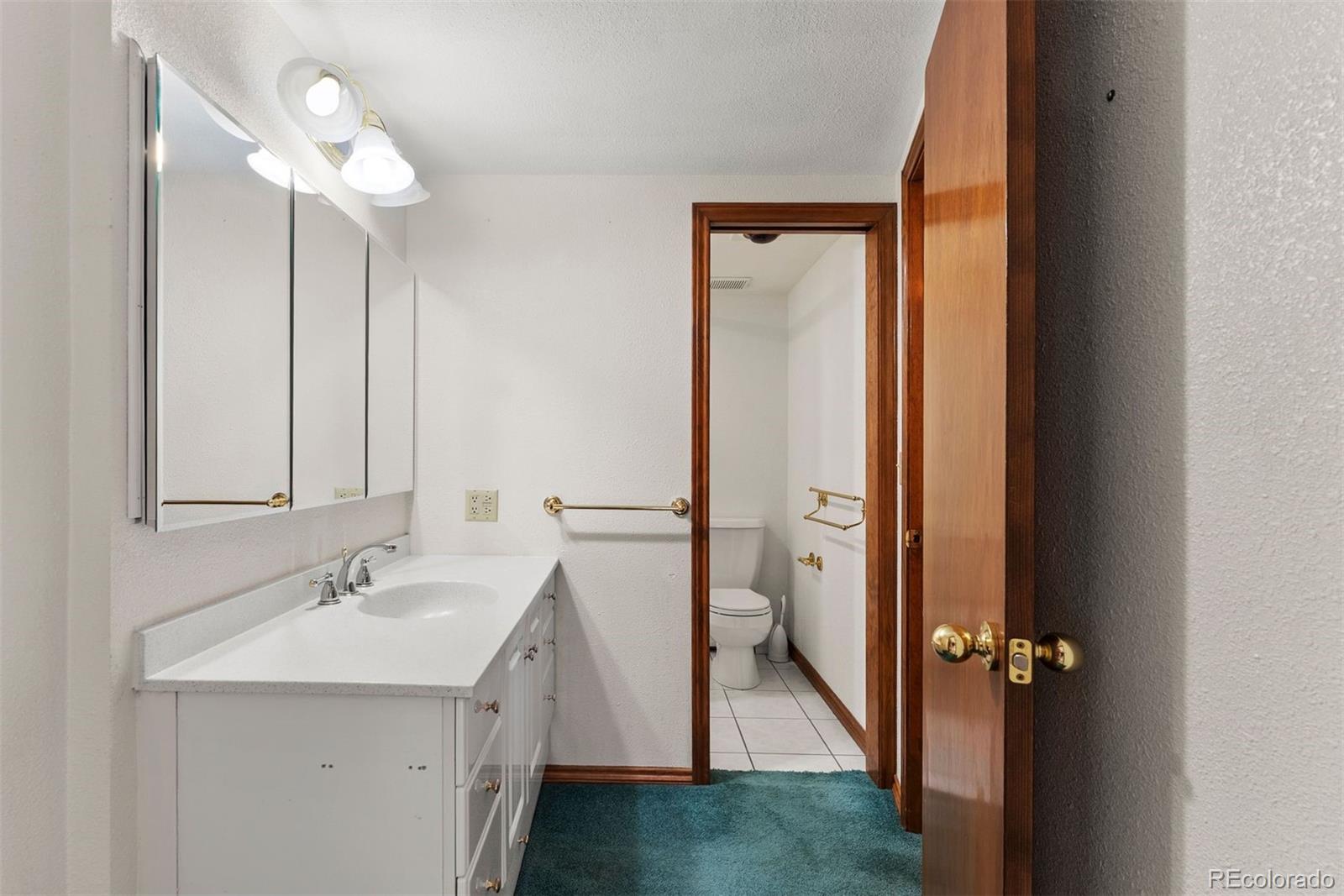 229 Highway 8 Morrison, CO 80465 - Photo 14 of 34 a bathroom with a sink a light fixture and a mirror