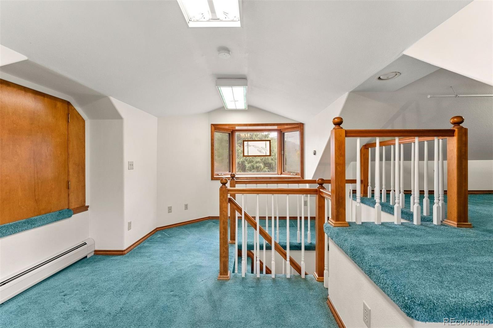229 Highway 8 Morrison, CO 80465 - Photo 20 of 34 a view of entryway and hall with wooden floor