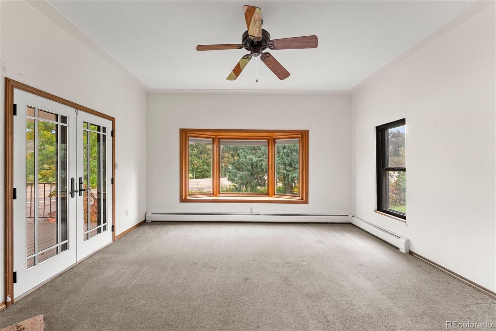 229 Highway 8 Morrison, CO 80465 - Photo 9 of 34 a view of room with window and ceiling fan