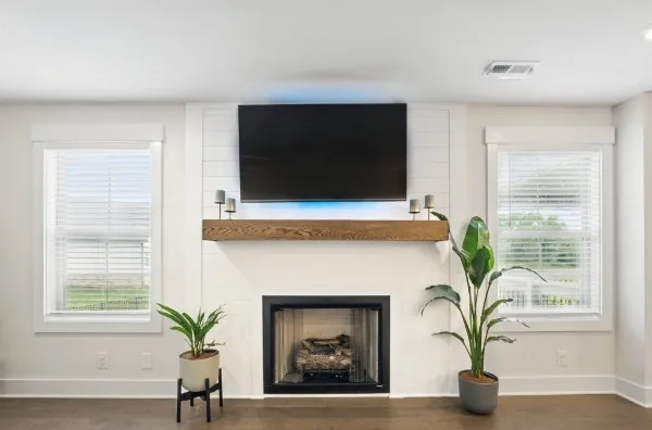 a living room with furniture and a fireplace