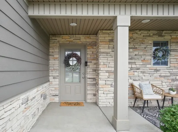 a front view of a house with chairs