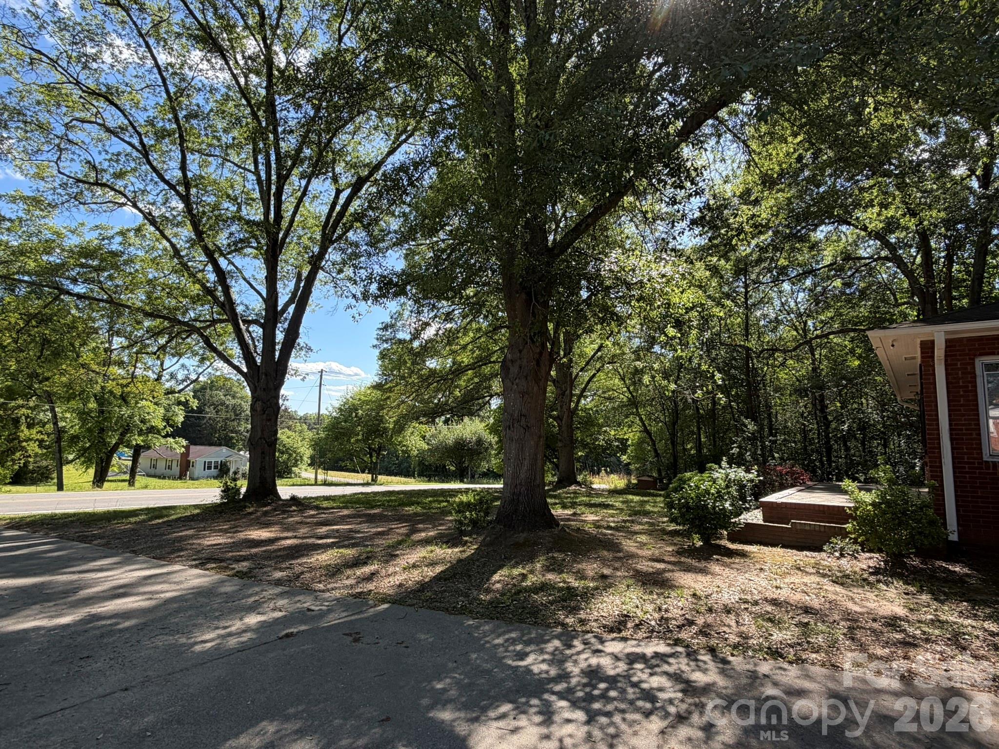 382 Alexis High Shoals Road Dallas, NC 28034 - Photo 6 of 43 a view of road with trees