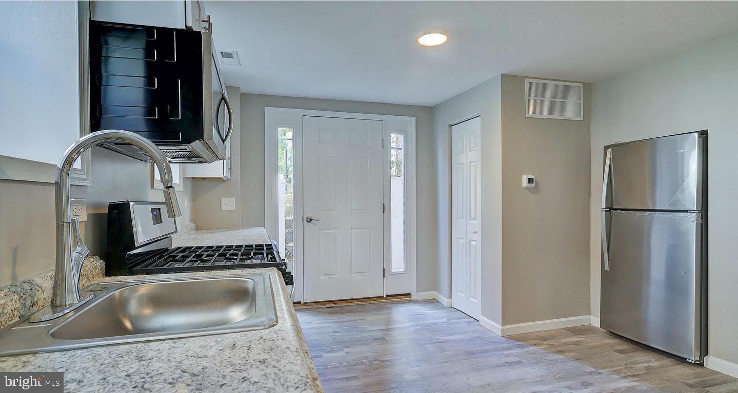 6110 41st Avenue, Unit C Hyattsville, MD 20782 - Photo 1 of 11 a kitchen with sink and refrigerator