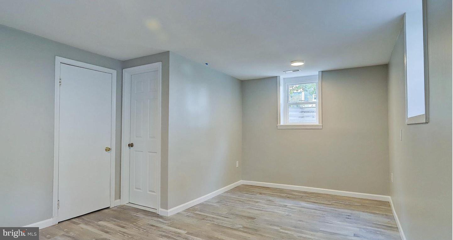 6110 41st Avenue, Unit C Hyattsville, MD 20782 - Photo 5 of 11 a view of an empty room with wooden floor and closet
