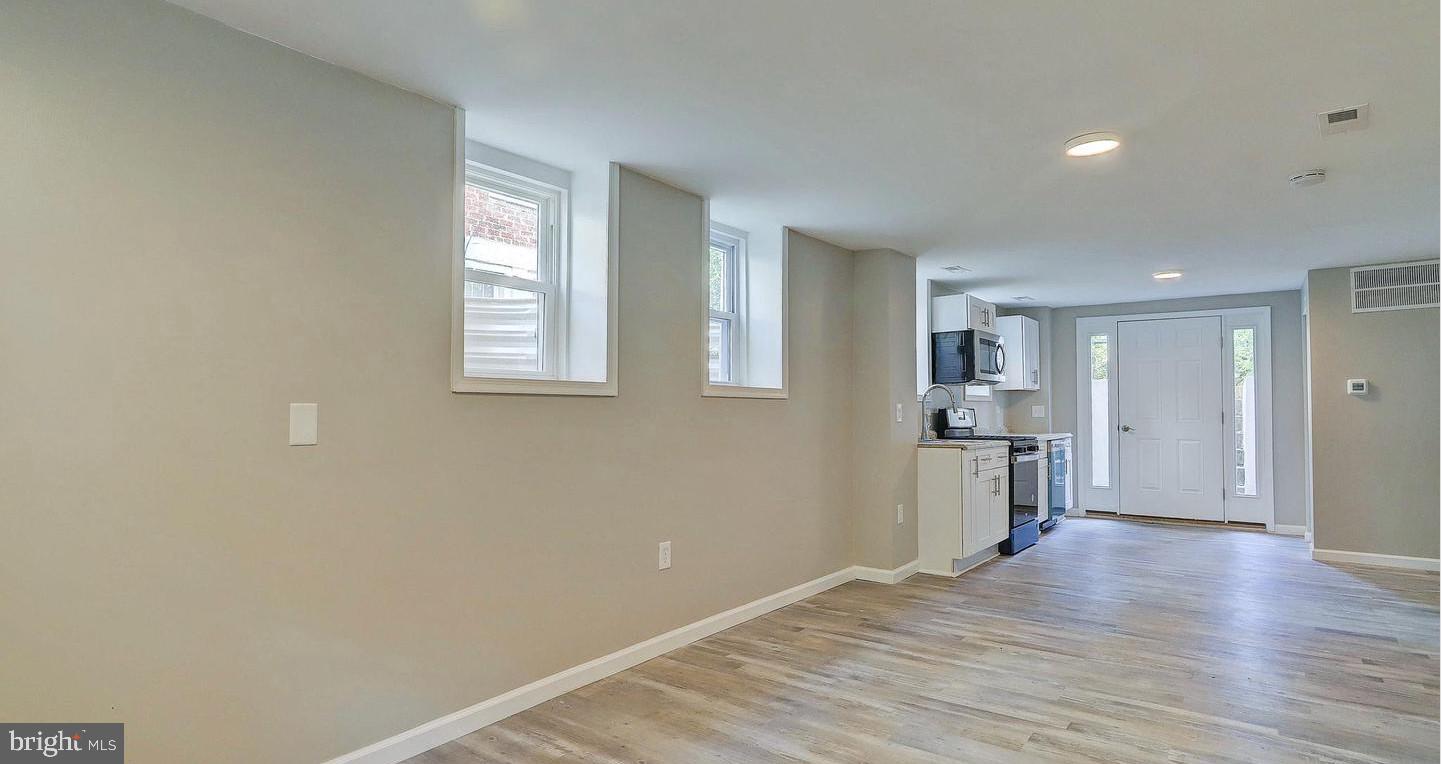 6110 41st Avenue, Unit C Hyattsville, MD 20782 - Photo 7 of 11 a view of empty room with wooden floor