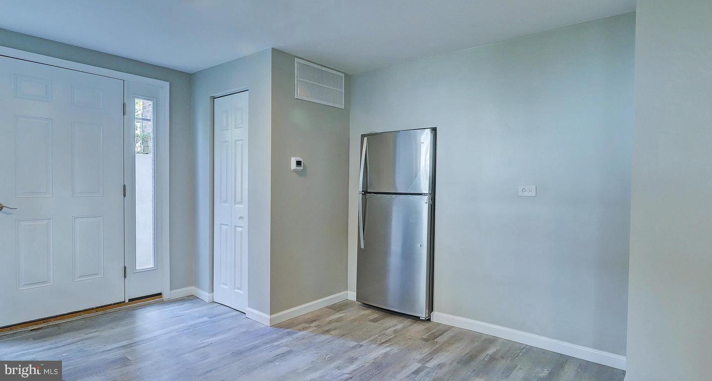 6110 41st Avenue, Unit C Hyattsville, MD 20782 - Photo 8 of 11 a view of an empty room with wooden floor and closet