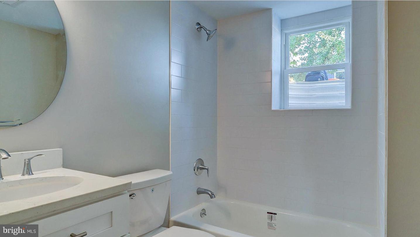 6110 41st Avenue, Unit C Hyattsville, MD 20782 - Photo 9 of 11 a bathroom with a bathtub and a sink