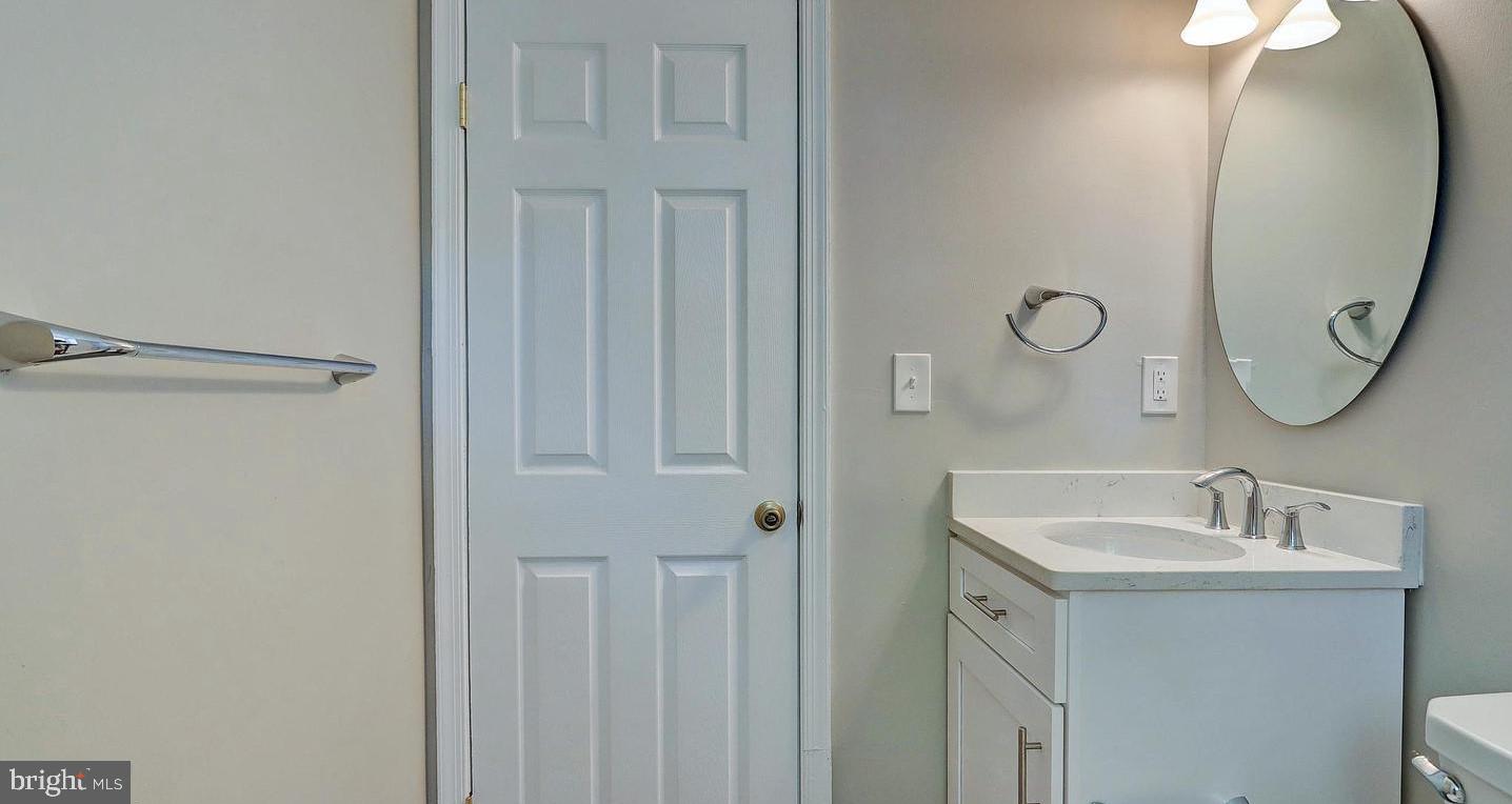 6110 41st Avenue, Unit C Hyattsville, MD 20782 - Photo 10 of 11 a bathroom with a sink and a mirror