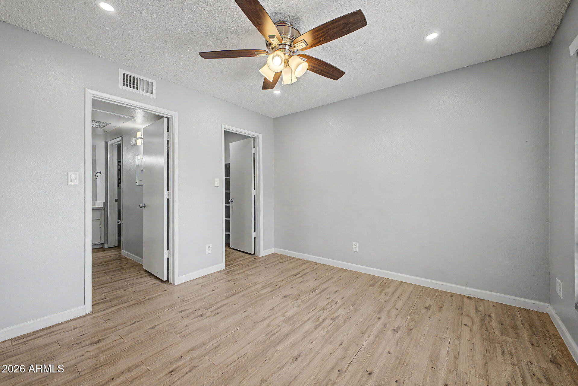 2625 East Indian School Road, Unit 227 Phoenix, AZ 85016 - Photo 14 of 31 wooden floor in an empty room with a window