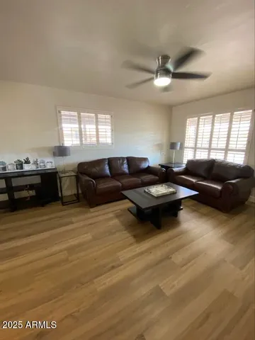 a living room with furniture window and a table