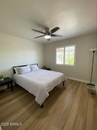 a bedroom with a bed and window