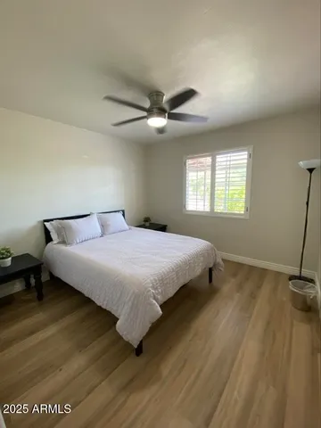 a bedroom with a bed and window