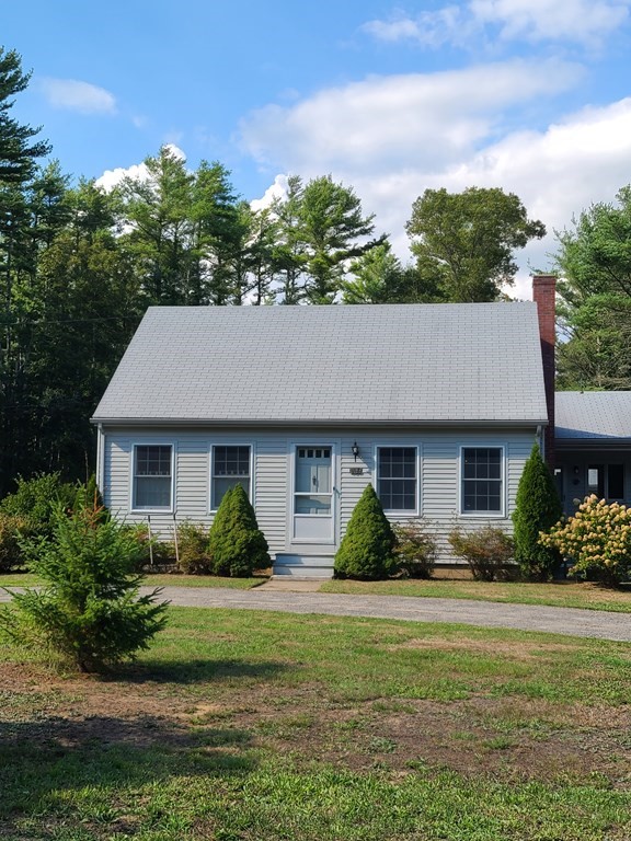 199 New Bedford Road Rochester, MA 02770 - Photo 1 of 20 a front view of a house with a garden