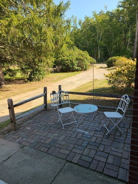 199 New Bedford Road Rochester, MA 02770 - Photo 14 of 20 a view of a terrace with chairs