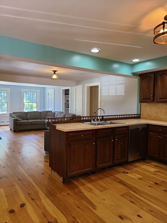 199 New Bedford Road Rochester, MA 02770 - Photo 5 of 20 a kitchen with stainless steel appliances granite countertop a sink and cabinets