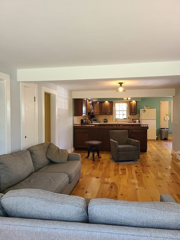 199 New Bedford Road Rochester, MA 02770 - Photo 6 of 20 a living room with furniture and a wooden floor