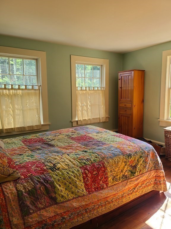 199 New Bedford Road Rochester, MA 02770 - Photo 8 of 20 a bedroom with a bed and glass window