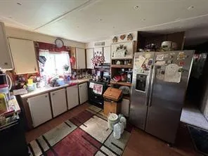 a view of a livingroom with a couch and a window