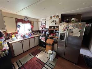 9830 Esthlyn Street Keithville, LA 71047 - Photo 13 of 16 a storage room with washer and dryer