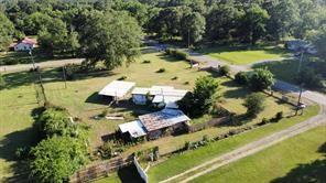 9830 Esthlyn Street Keithville, LA 71047 - Photo 4 of 16 a view of swimming pool with lawn chairs and plants