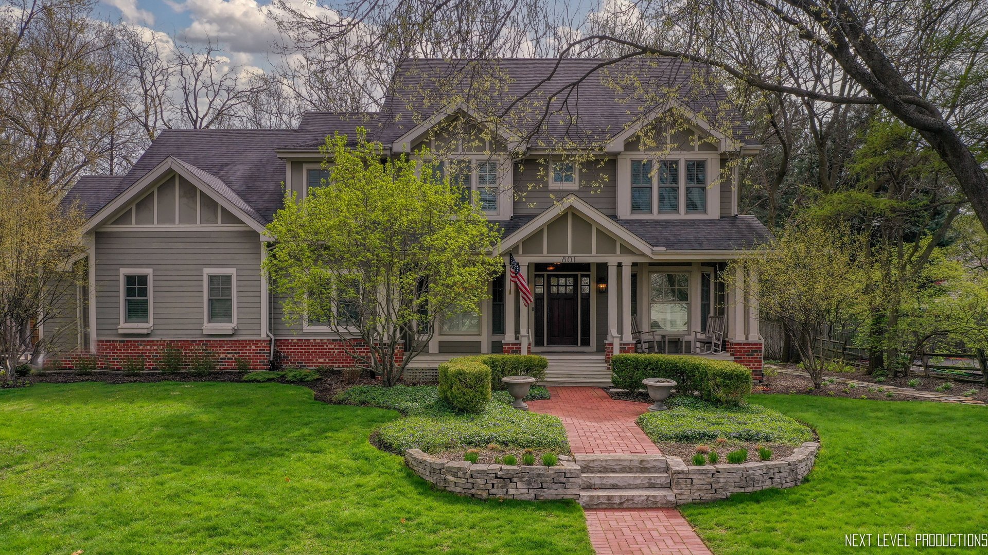 801 Meadows Road Geneva, IL 60134 - Photo 1 of 14 a front view of a house with a yard and porch