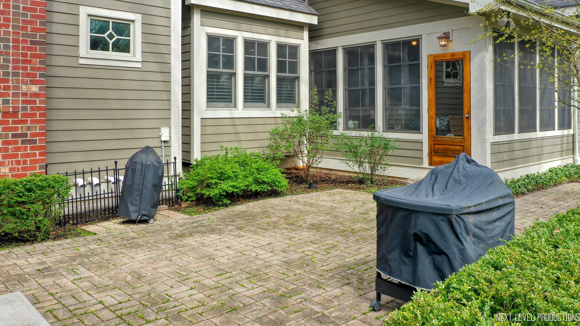 801 Meadows Road Geneva, IL 60134 - Photo 11 of 14 a view of a house with sitting area and garden